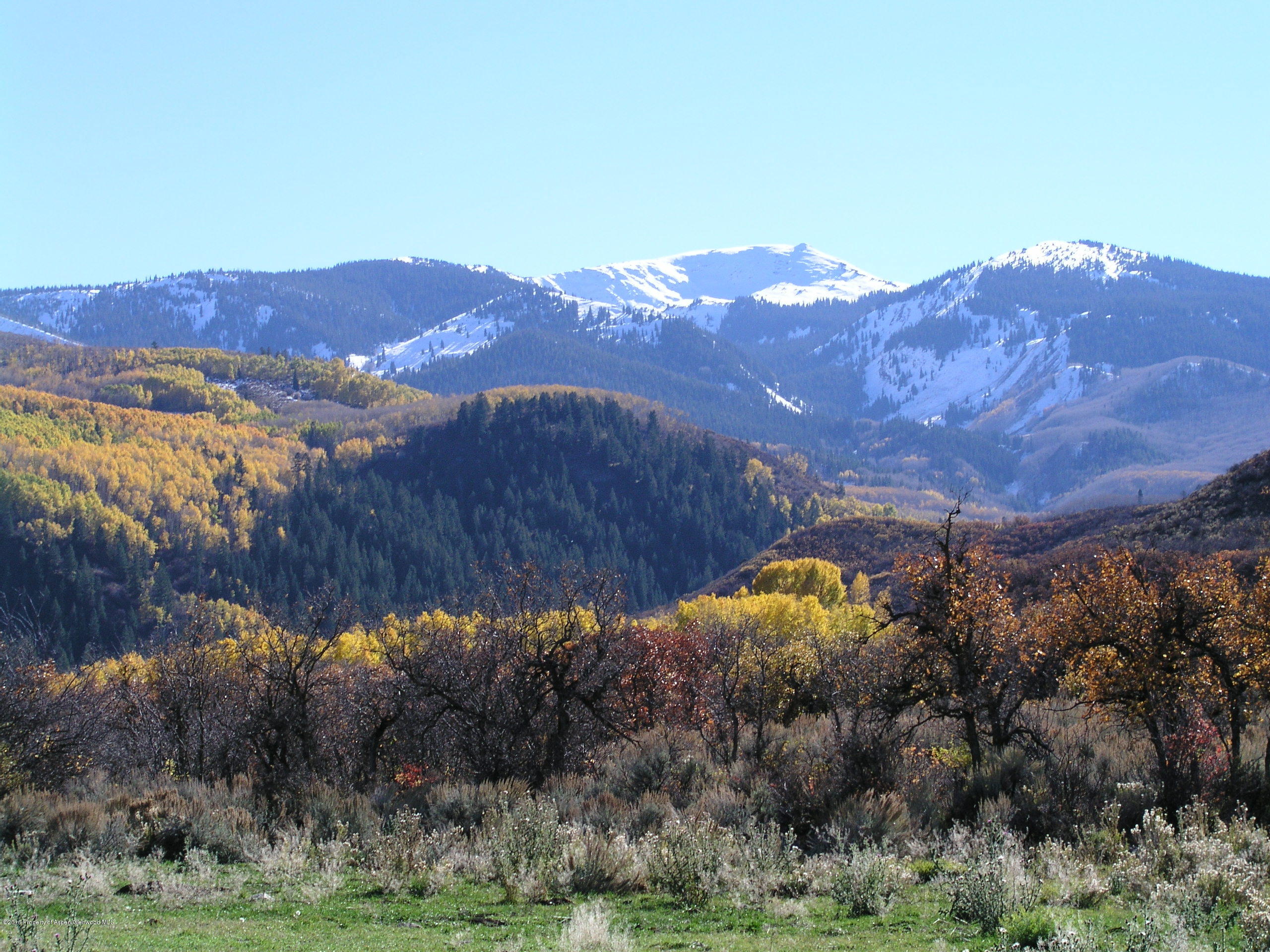 4516 Capitol Creek Road Snowmass, CO 81654 - Photo 57 of 59 front view of a house and a mountain view