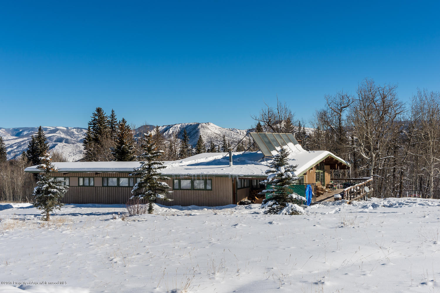 4516 Capitol Creek Road Snowmass, CO 81654 - Photo 6 of 59 a view of a chairs and table in the patio