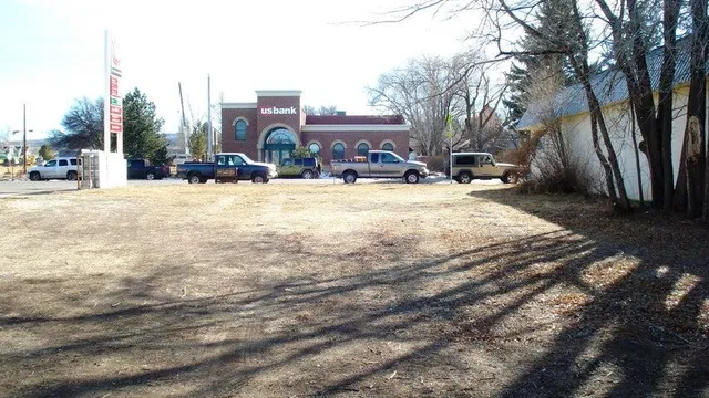 a swimming pool with outdoor seating and yard