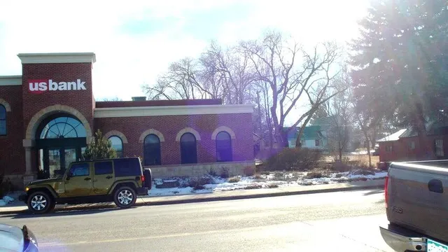 a view of a street with an outdoor seating