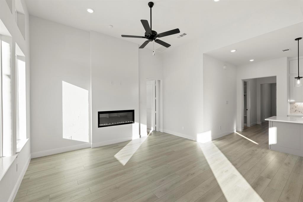 1105 Birdsong Trail Anna, TX 75409 - Photo 15 of 27 a view of livingroom with hardwood floor and a ceiling fan