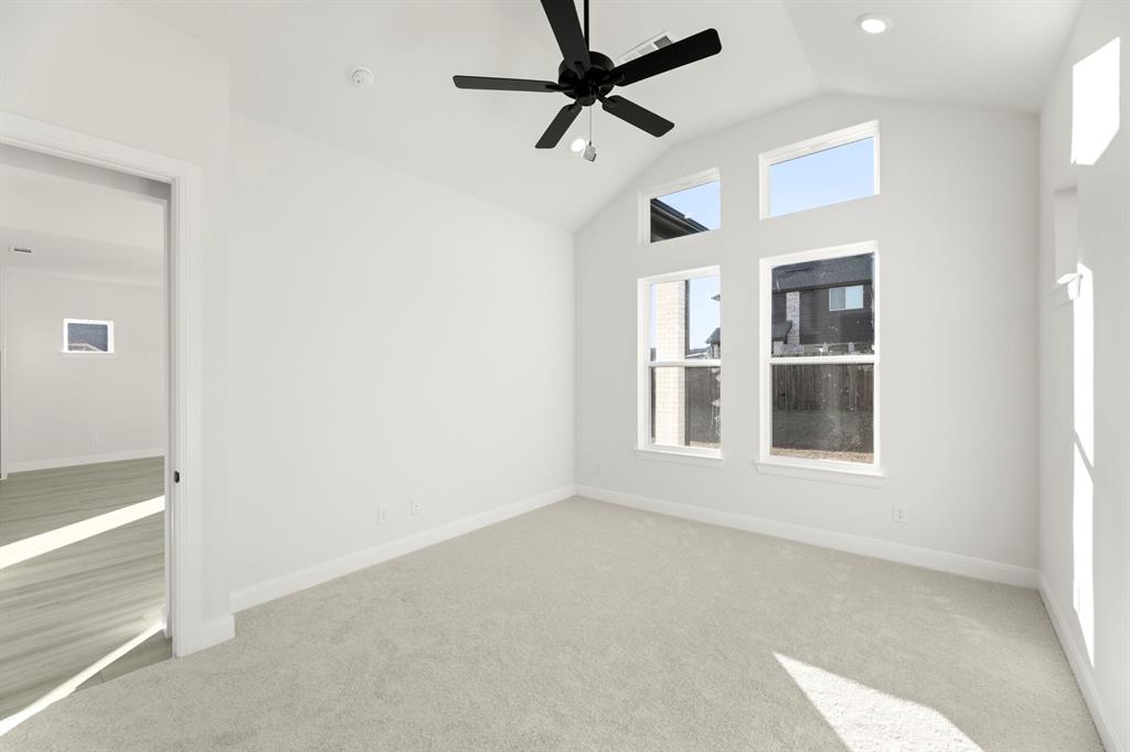 1105 Birdsong Trail Anna, TX 75409 - Photo 17 of 27 an empty room with windows and fan