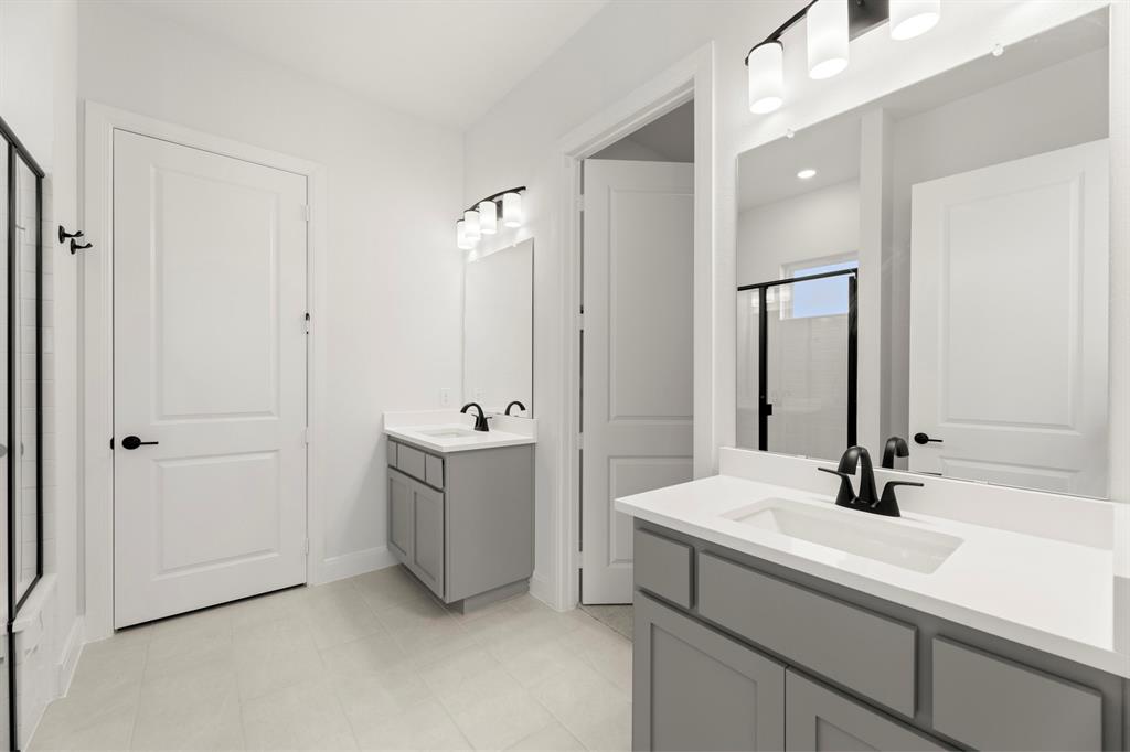 1105 Birdsong Trail Anna, TX 75409 - Photo 19 of 27 a bathroom with a sink and a mirror