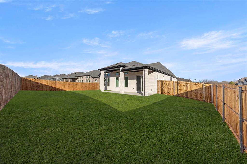 1105 Birdsong Trail Anna, TX 75409 - Photo 25 of 27 a view of a terrace with a garden