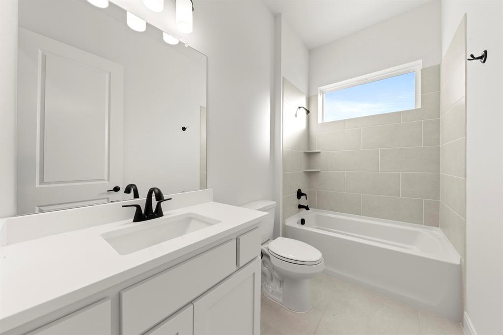 1105 Birdsong Trail Anna, TX 75409 - Photo 4 of 27 a bathroom with a sink a toilet and shower