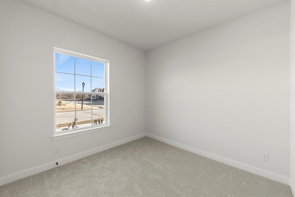 1105 Birdsong Trail Anna, TX 75409 - Photo 5 of 27 an empty room with a window