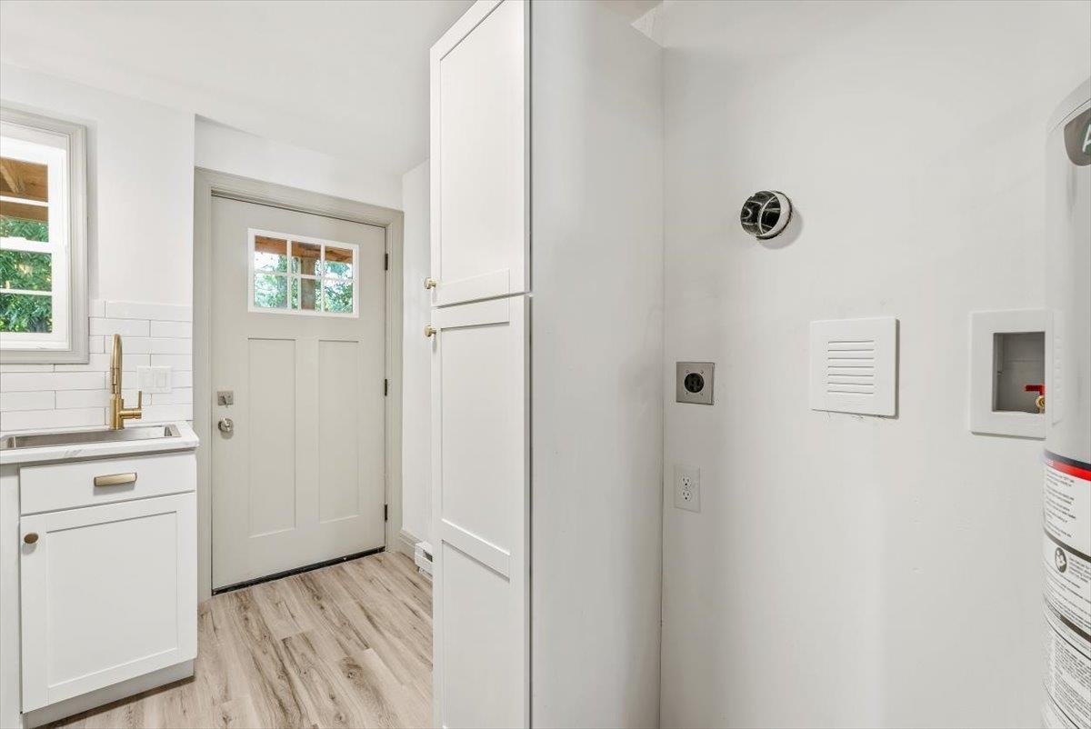 143 North Elkin Avenue Waynesboro, VA 22980 - Photo 11 of 36 a view of a kitchen with white cabinets and sink