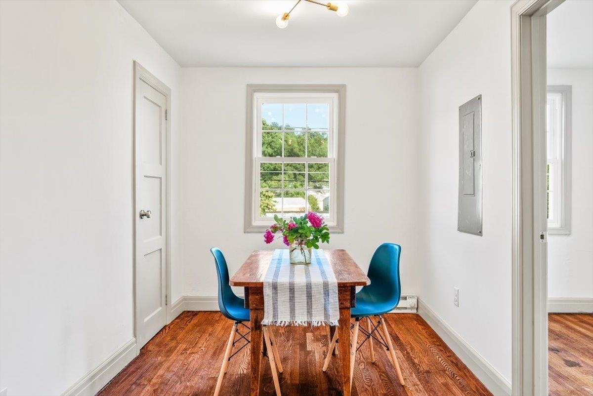 143 North Elkin Avenue Waynesboro, VA 22980 - Photo 12 of 36 a view of a dining room with furniture a potted plant and wooden floor