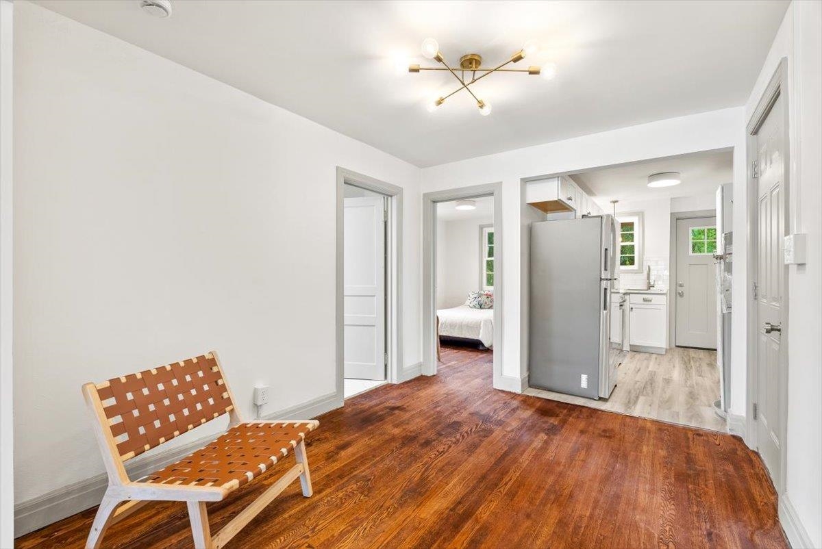 143 North Elkin Avenue Waynesboro, VA 22980 - Photo 14 of 36 a bedroom with a bed and wooden floor
