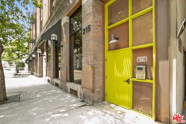 a view of a brick house with a large windows
