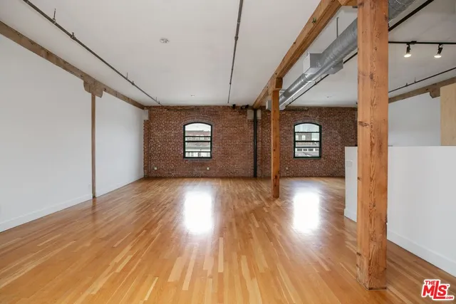 a view of a livingroom with wooden floor