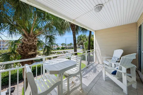 a view of an outdoor sitting area with furniture