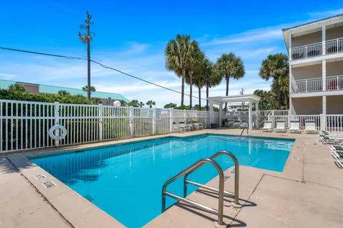 a view of a chairs and table in the patio