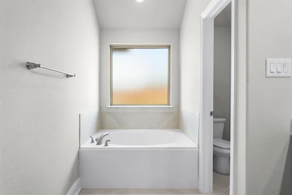 a bathroom with bathtub and a shower