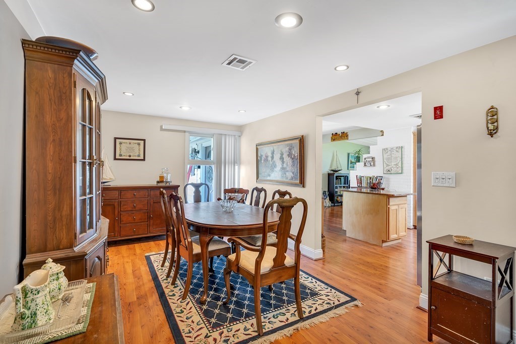 7 Leonard Road Framingham, MA 01701 - Photo 11 of 27 a view of a dining room with furniture and wooden floor