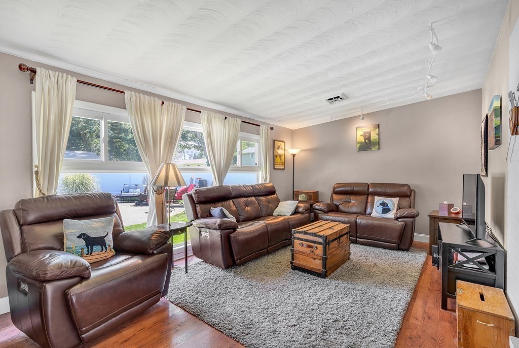 7 Leonard Road Framingham, MA 01701 - Photo 12 of 27 a living room with furniture and a large window