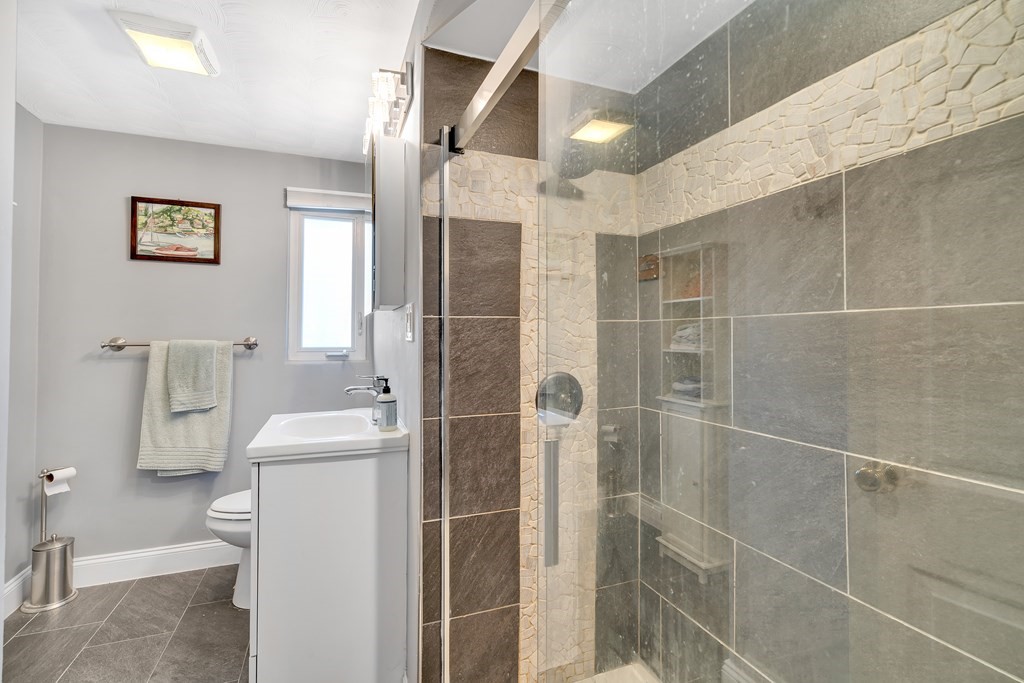 7 Leonard Road Framingham, MA 01701 - Photo 14 of 27 a bathroom with a toilet and a shower