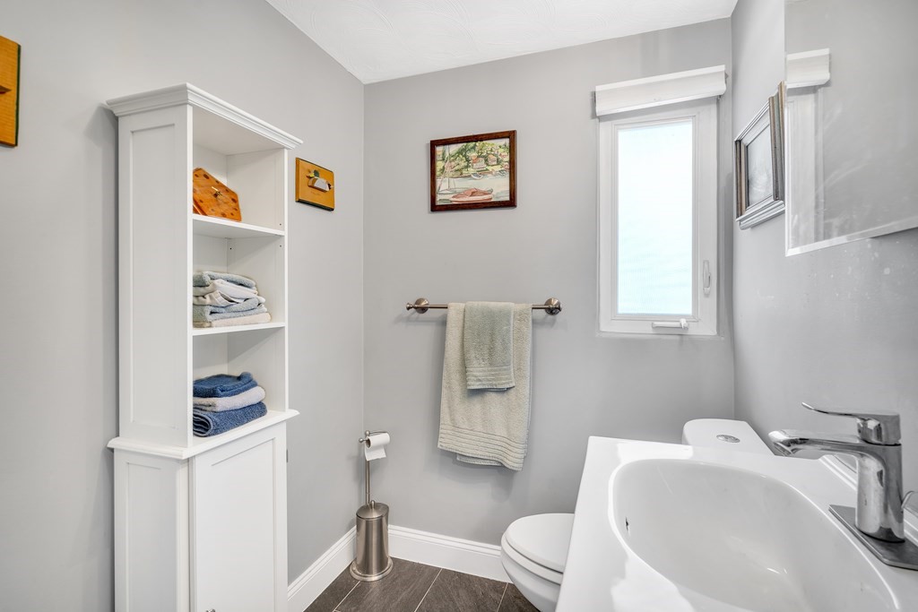 7 Leonard Road Framingham, MA 01701 - Photo 15 of 27 a bathroom with a sink and a mirror