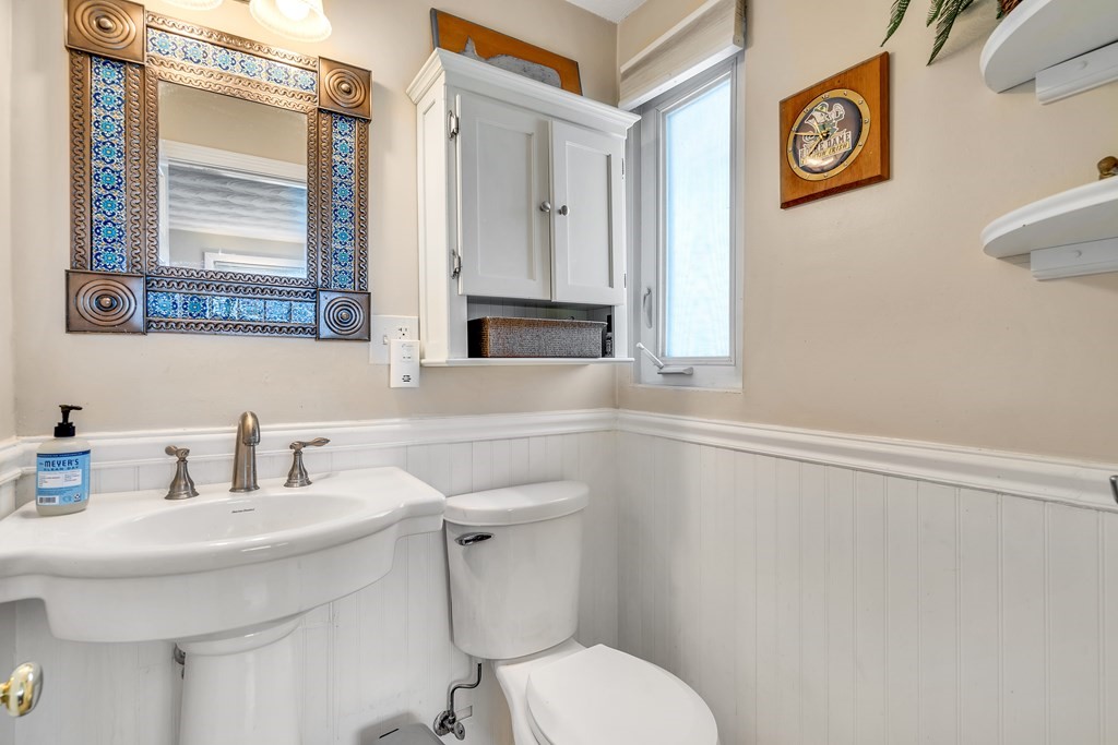 7 Leonard Road Framingham, MA 01701 - Photo 19 of 27 a bathroom with a toilet sink and mirror