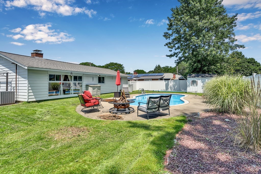 7 Leonard Road Framingham, MA 01701 - Photo 23 of 27 a view of a house with backyard porch and sitting area