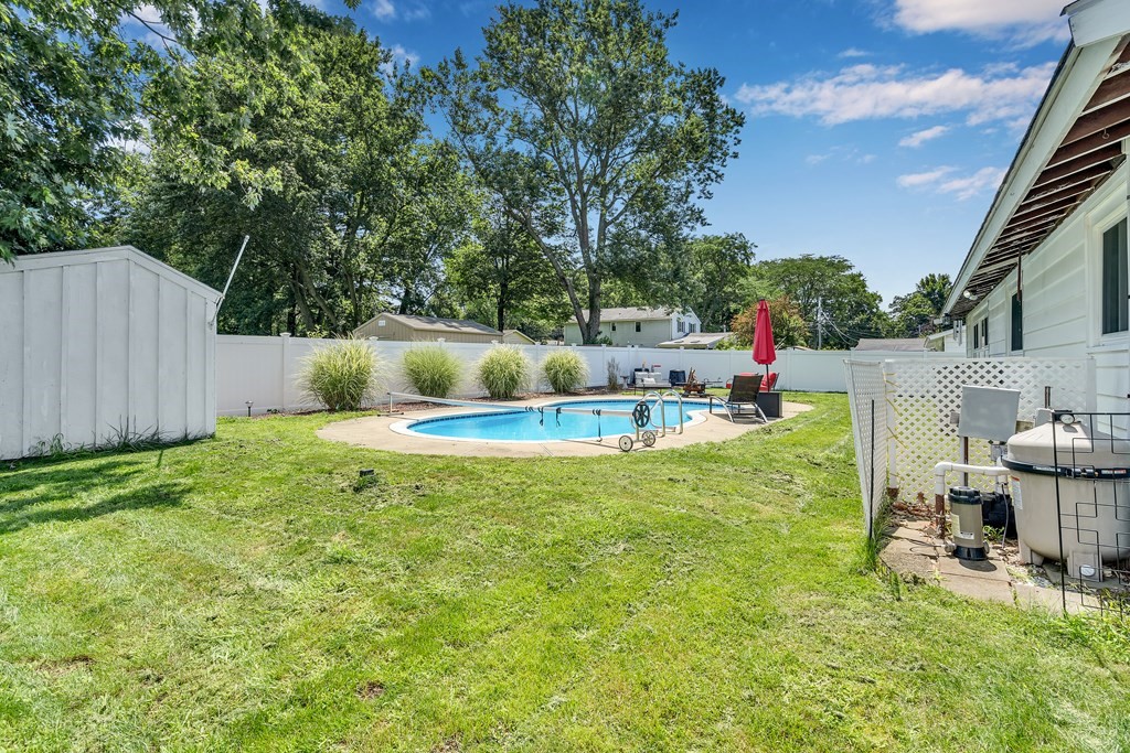 7 Leonard Road Framingham, MA 01701 - Photo 25 of 27 a view of backyard with swimming pool and seating space
