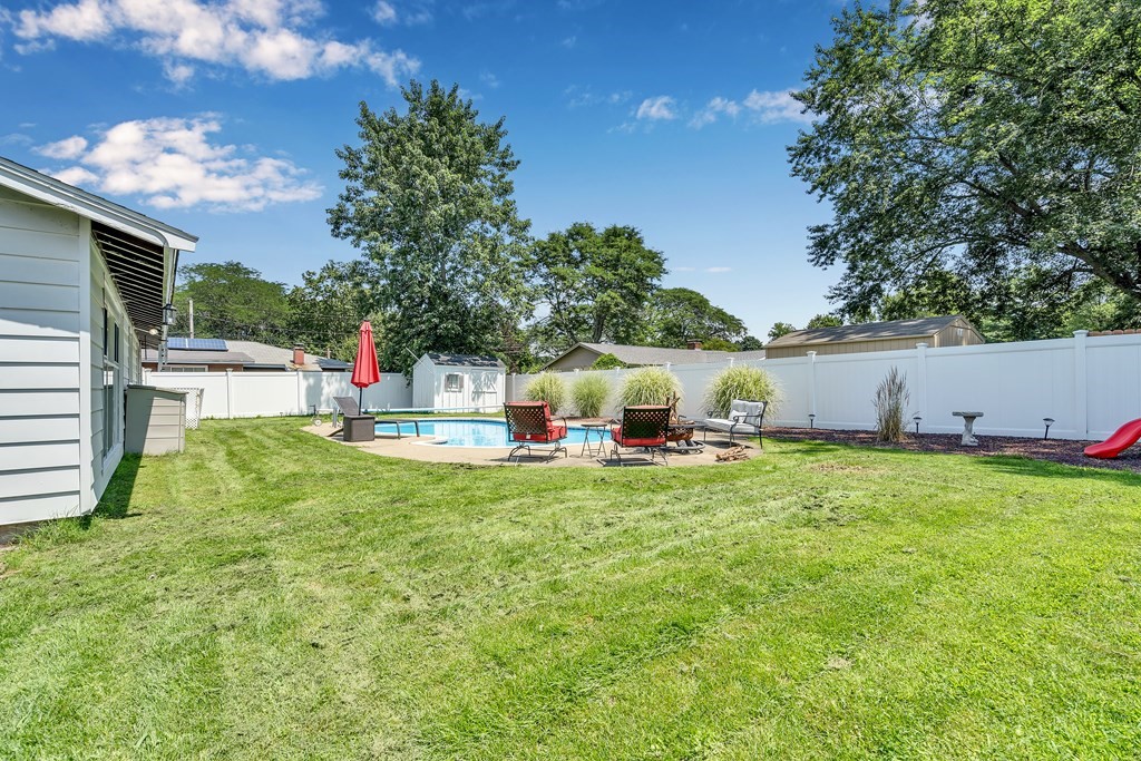 7 Leonard Road Framingham, MA 01701 - Photo 26 of 27 a view of backyard with table and chairs and potted plants