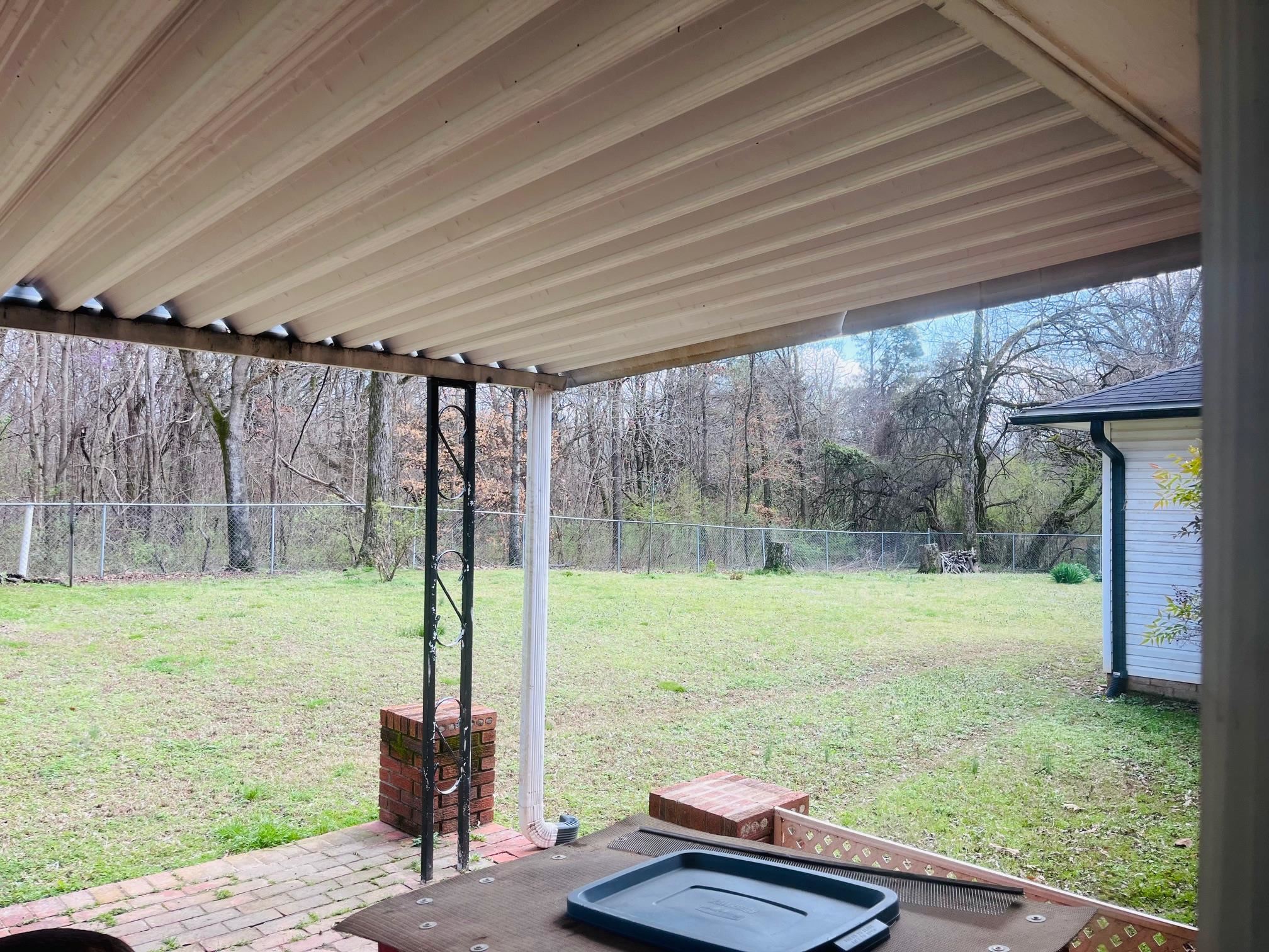 6702 Raleigh Millington Road Millington, TN 38053 - Photo 15 of 20 a backyard of a house with lots of green space and seating space