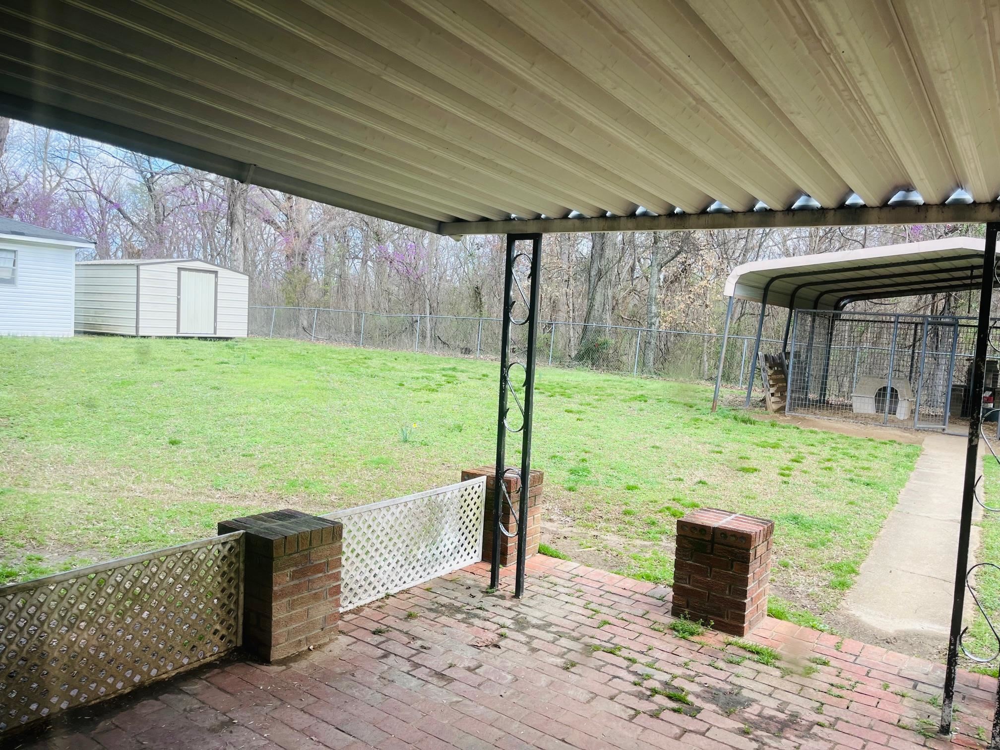 6702 Raleigh Millington Road Millington, TN 38053 - Photo 16 of 20 a backyard of a house with table and chairs