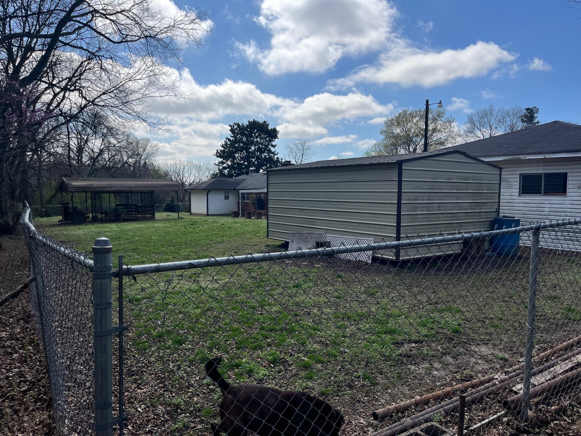6702 Raleigh Millington Road Millington, TN 38053 - Photo 20 of 20 a backyard of a house with lots of green space