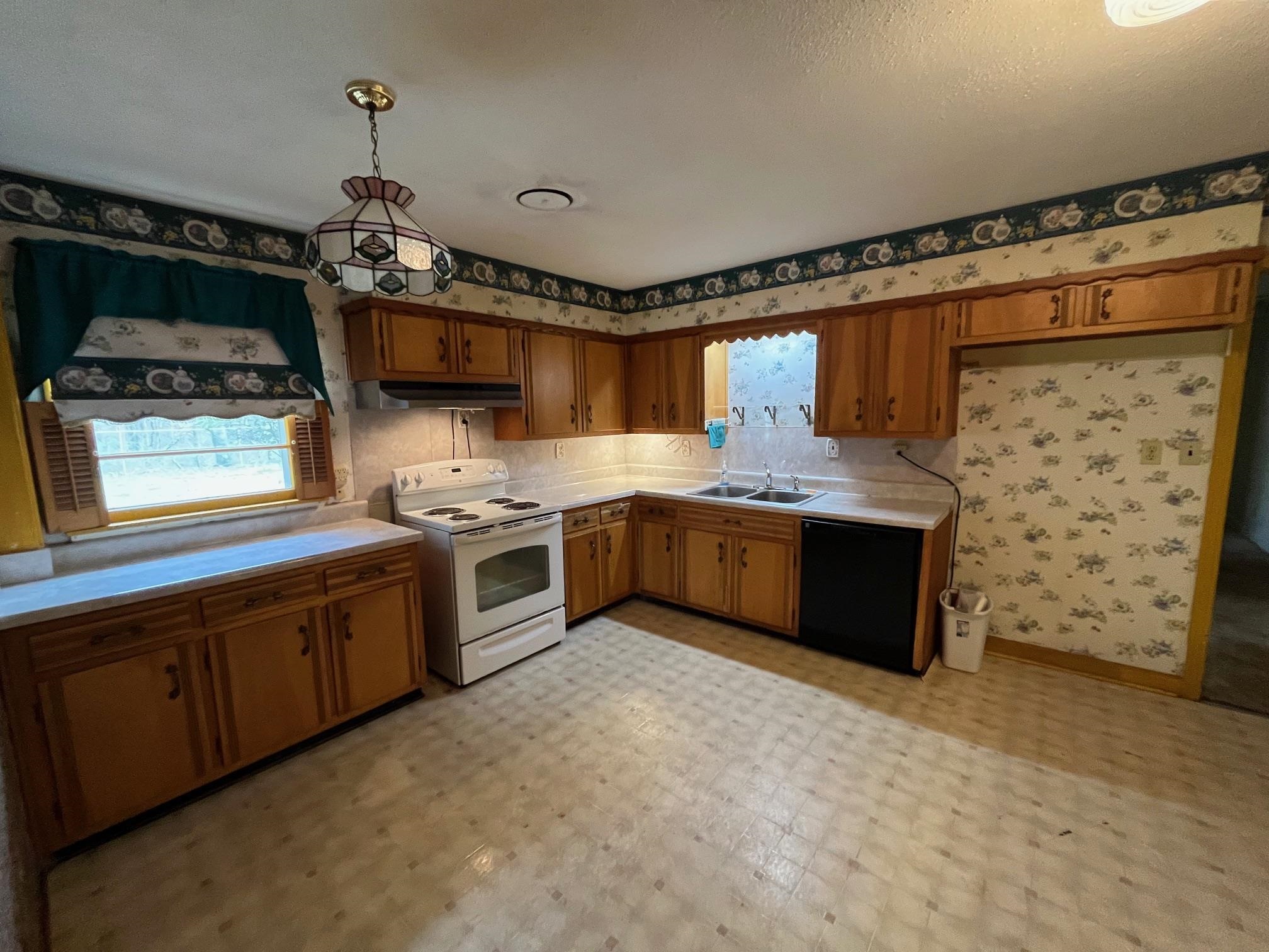 6702 Raleigh Millington Road Millington, TN 38053 - Photo 7 of 20 a kitchen with stainless steel appliances granite countertop a stove a sink and a microwave