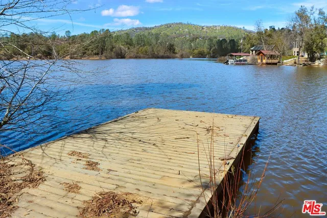 a view of swimming pool with lake view and mountain view