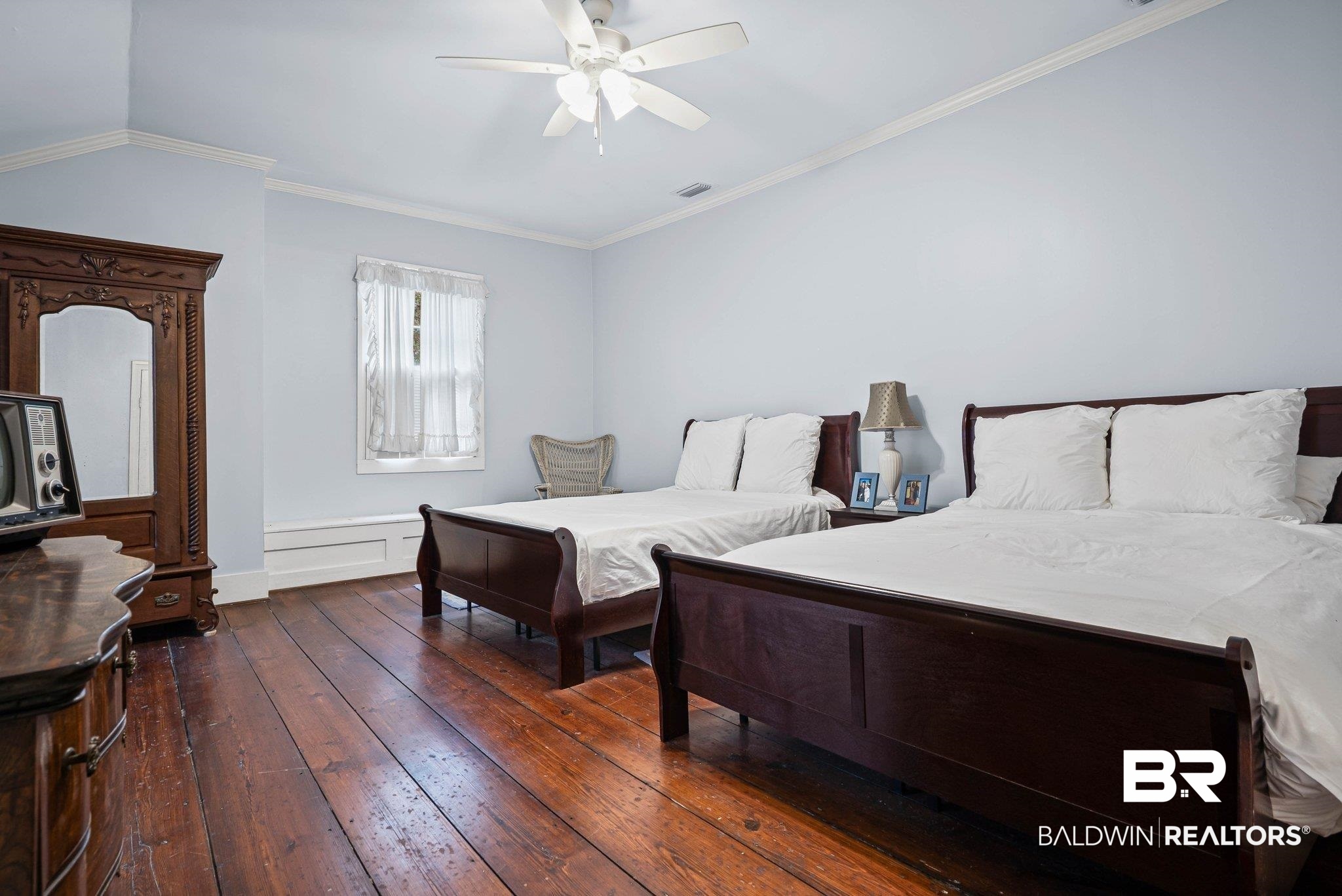 23561 Main Street Fairhope, AL 36532 - Photo 19 of 45 Bedroom featuring crown molding, dark wood-style flooring, and a ceiling fan