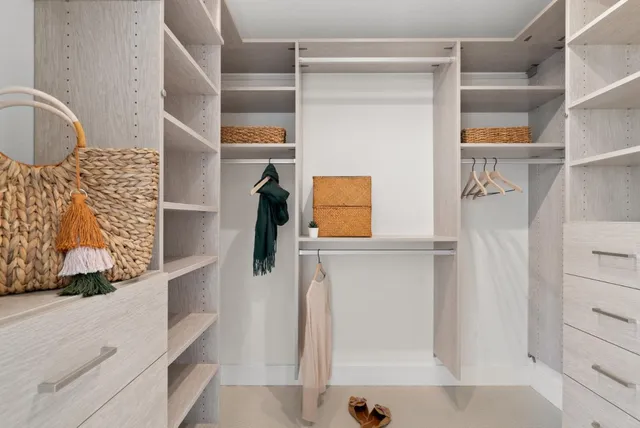 a bathroom with a double vanity sink toilet and a mirror