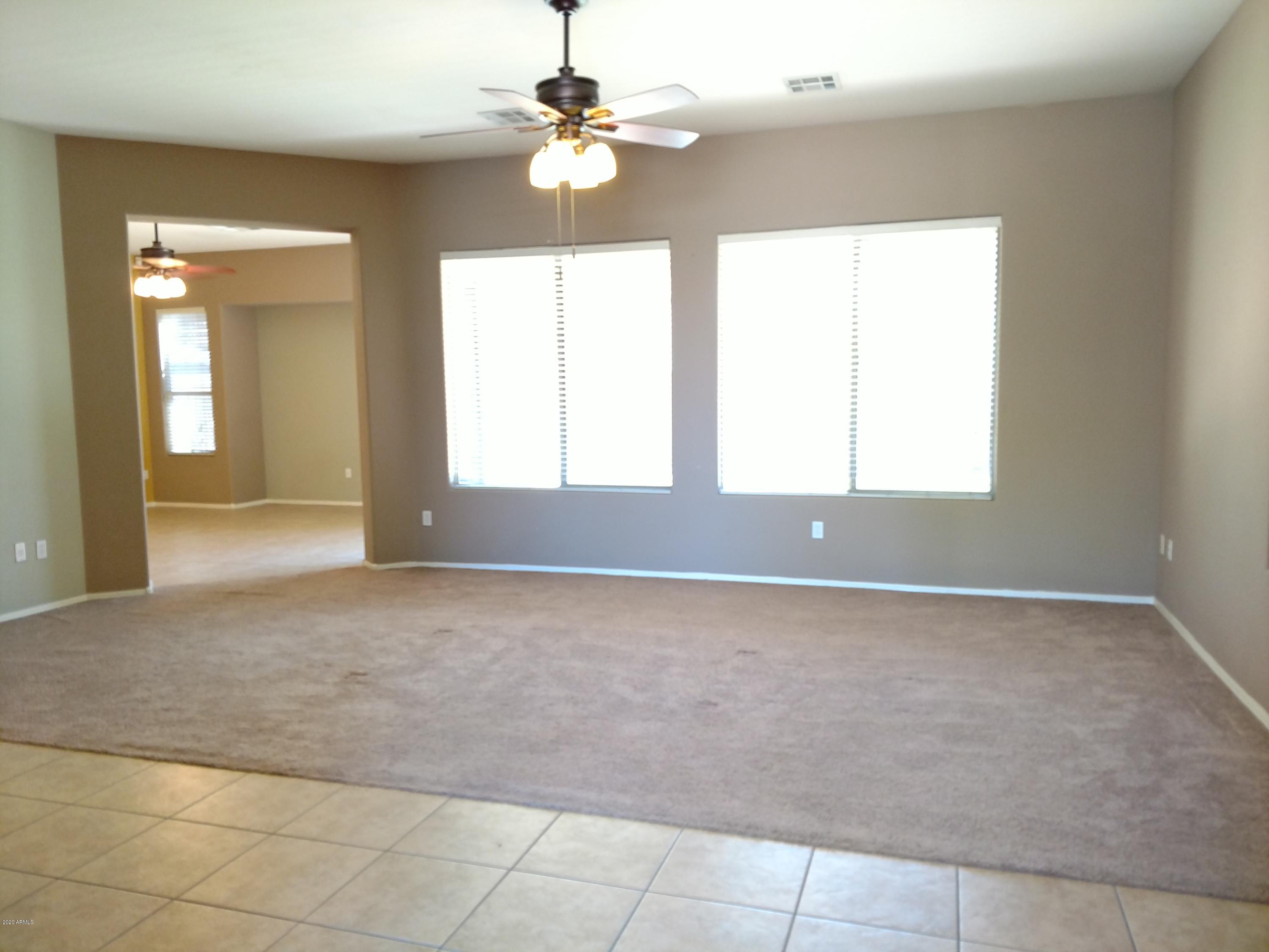 3295 East Los Altos Road Gilbert, AZ 85297 - Photo 3 of 22 a view of an empty room with a window