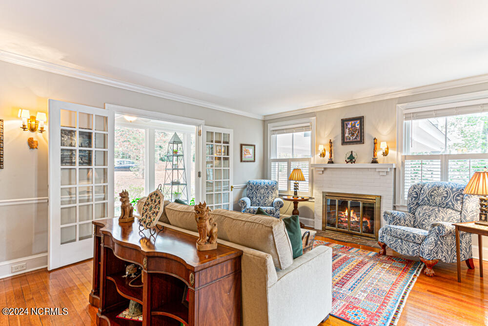 180 North Ridge Street Southern Pines, NC 28387 - Photo 23 of 72 Living Room open to Sunporch