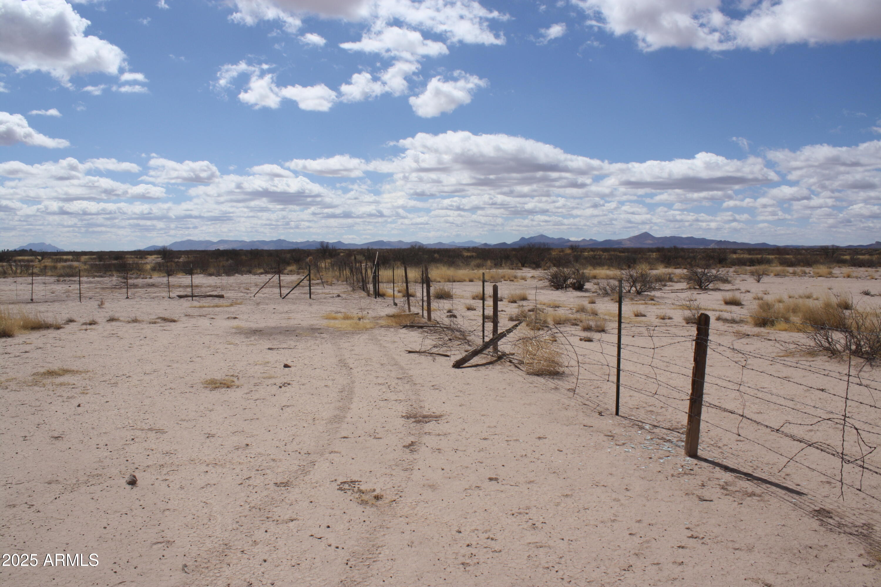 6872 North Brooks Road McNeal, AZ 85617 - Photo 18 of 24 a view of a dry yard with wooden fence