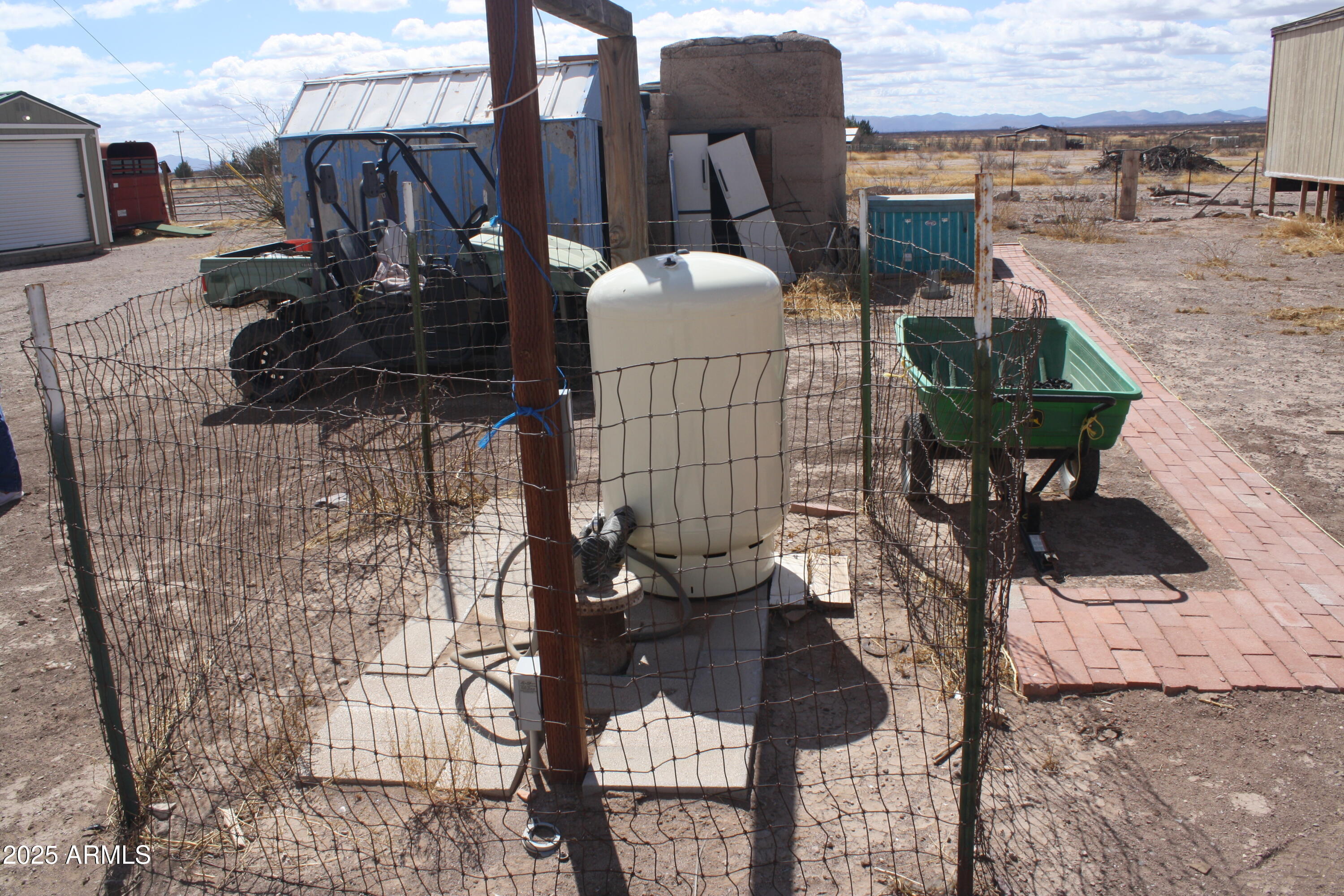 6872 North Brooks Road McNeal, AZ 85617 - Photo 4 of 24 a backyard of a house with table and chairs
