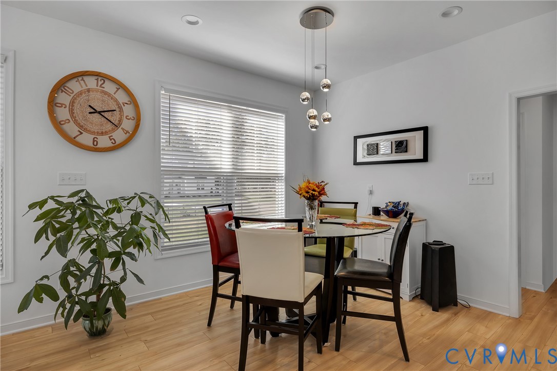 9400 Kinnerton Drive Midlothian, VA 23112 - Photo 12 of 43 a view of a dining room with furniture window and wooden floor