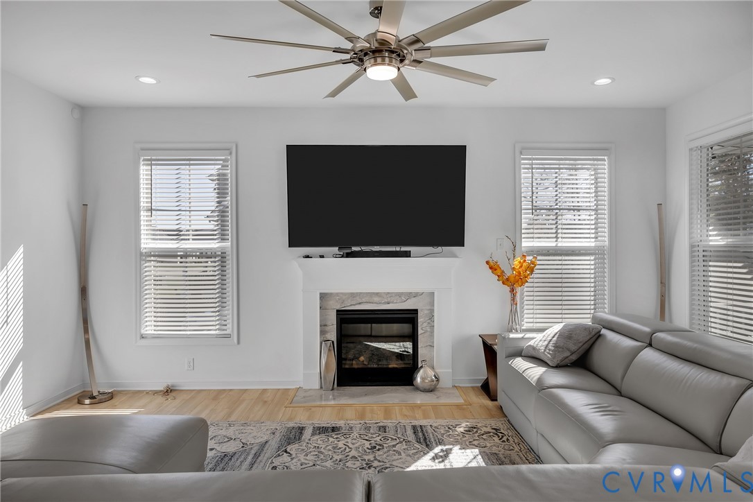 9400 Kinnerton Drive Midlothian, VA 23112 - Photo 13 of 43 a living room with furniture a fireplace and a flat screen tv