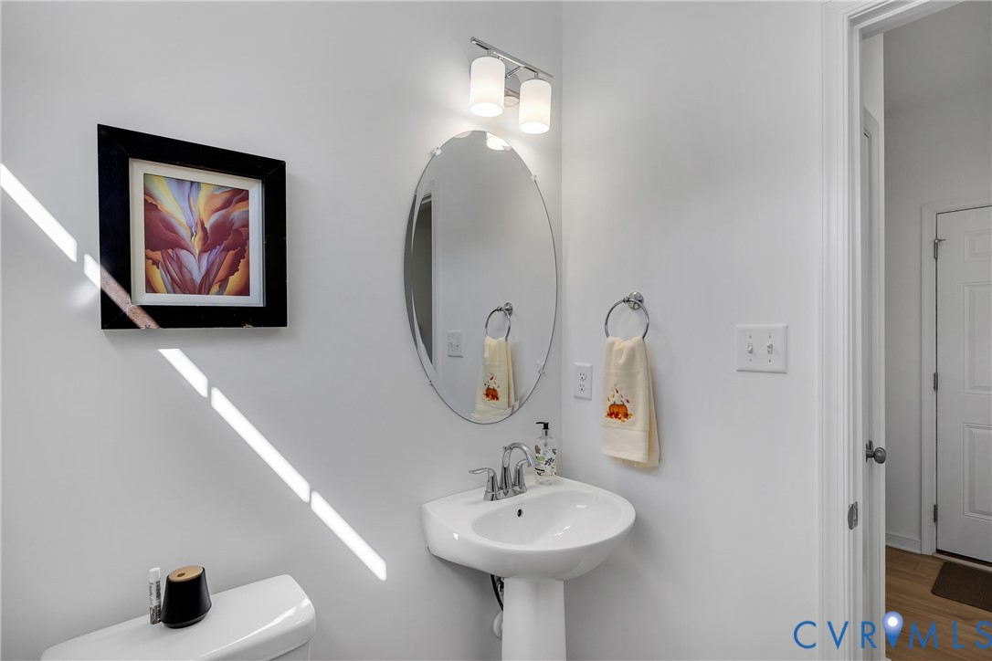 9400 Kinnerton Drive Midlothian, VA 23112 - Photo 15 of 43 a bathroom with a sink and a mirror