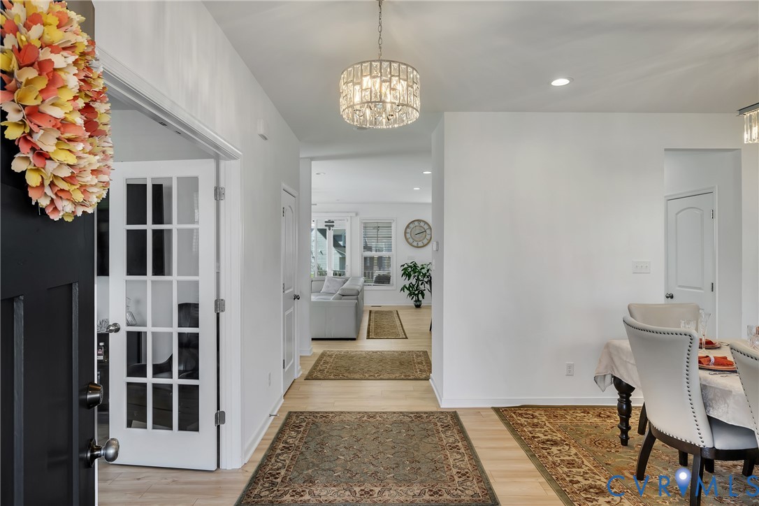 9400 Kinnerton Drive Midlothian, VA 23112 - Photo 5 of 43 a hallway with a dining table and chairs