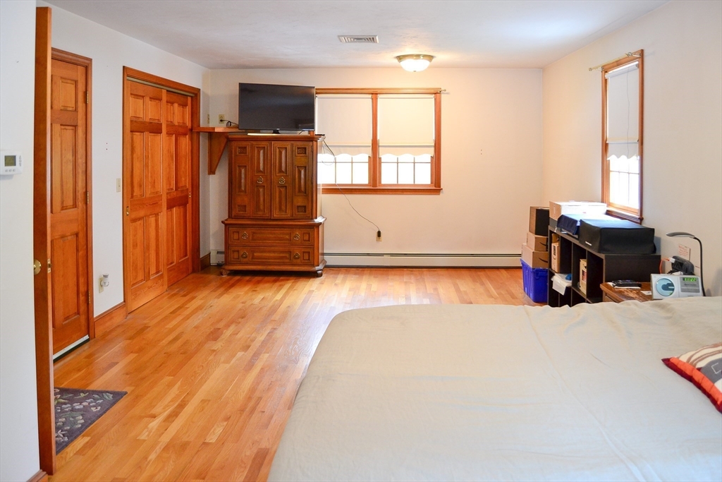 110 Mayflower Ridge Drive Wareham, MA 02571 - Photo 16 of 42 a living room with furniture and a flat screen tv
