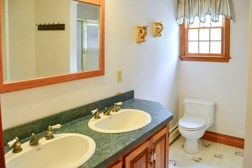 110 Mayflower Ridge Drive Wareham, MA 02571 - Photo 19 of 42 a bathroom with a sink and a mirror
