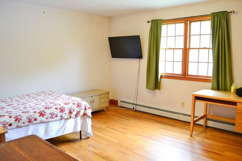 110 Mayflower Ridge Drive Wareham, MA 02571 - Photo 21 of 42 a bedroom with a bed and a chair