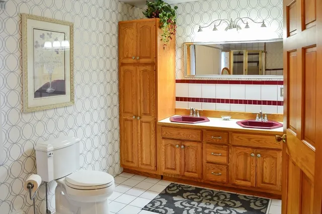 a kitchen with stainless steel appliances granite countertop a refrigerator and a stove