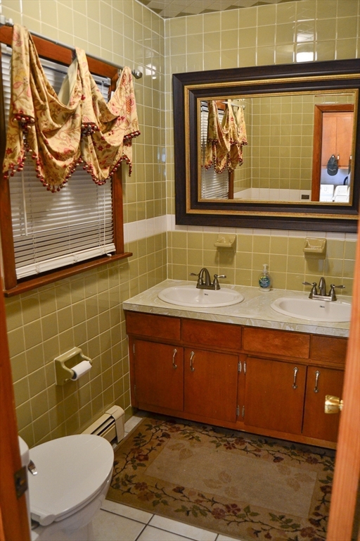 110 Mayflower Ridge Drive Wareham, MA 02571 - Photo 36 of 42 a bathroom with a sink and a mirror