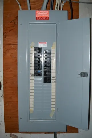 a dining room with a table and chairs