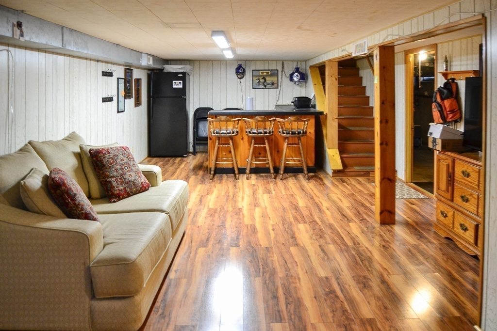 110 Mayflower Ridge Drive Wareham, MA 02571 - Photo 40 of 42 a living room with furniture and wooden floor