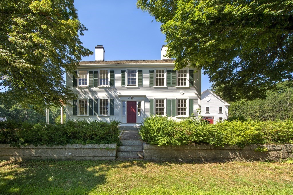 128 Washington Street, Unit F Hanover, MA 02339 - Photo 1 of 42 a front view of a house with a garden