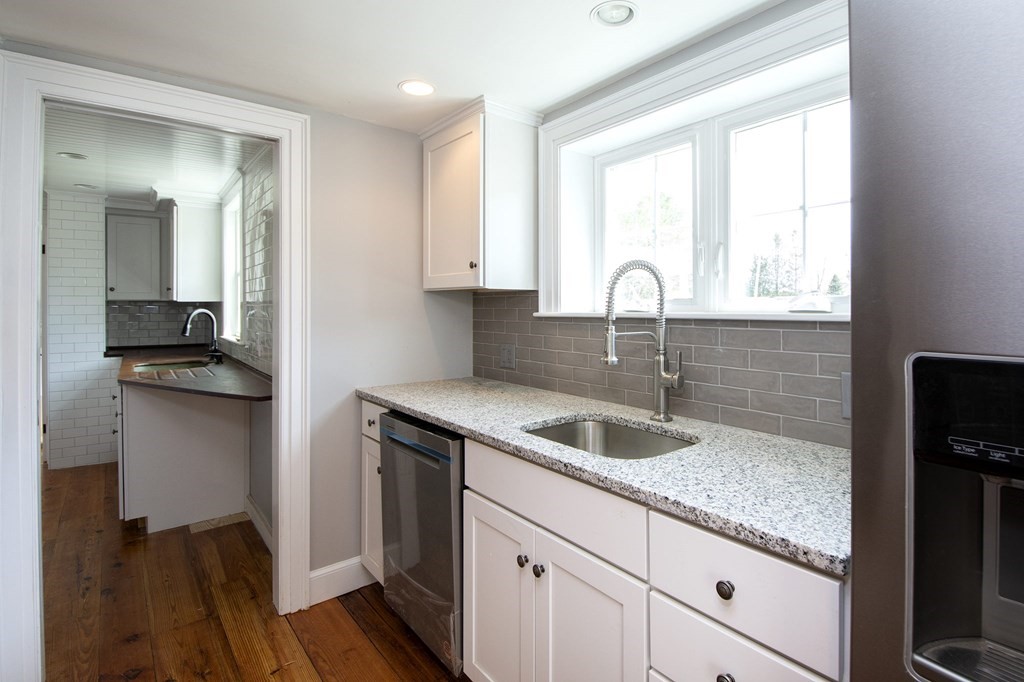 128 Washington Street, Unit F Hanover, MA 02339 - Photo 15 of 42 a kitchen with sink a window and appliances